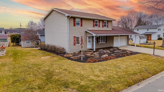 traditional-style home featuring concrete driveway, an attached garage, a storage shed, a front yard, and an outdoor structure