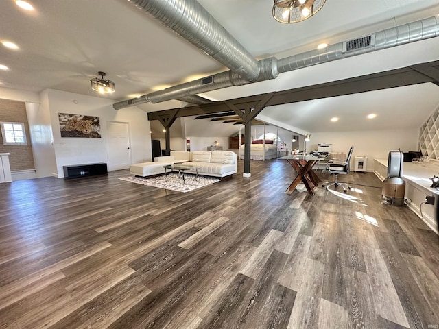 living area with recessed lighting, visible vents, and wood finished floors