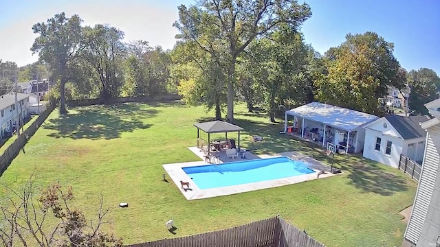 view of pool with a fenced in pool, a patio area, a lawn, and fence