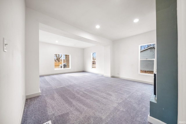 spare room with recessed lighting, carpet flooring, and baseboards