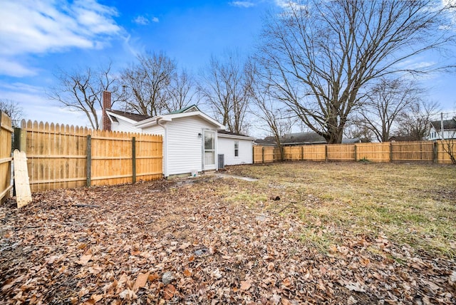 view of yard with a fenced backyard