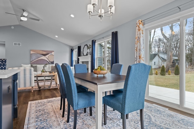 dining area featuring dark wood finished floors, recessed lighting, visible vents, an inviting chandelier, and vaulted ceiling