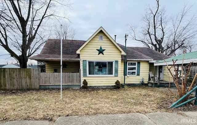 view of front of house with fence