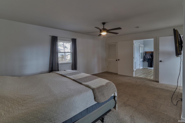 bedroom featuring carpet floors, a closet, and ceiling fan