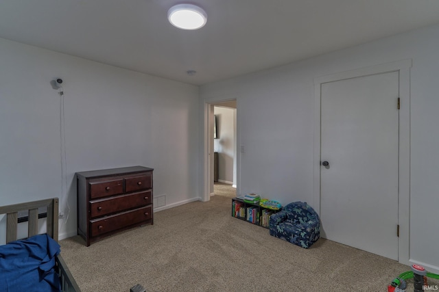 bedroom with carpet floors and visible vents