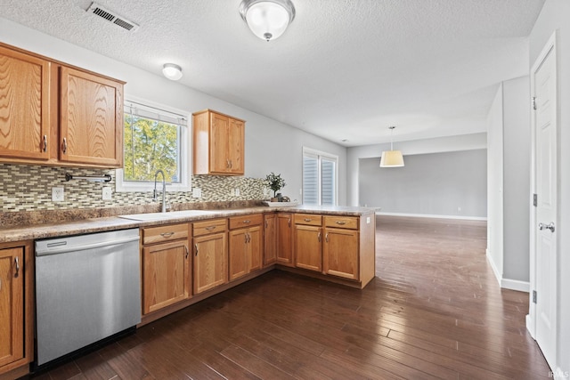 kitchen with dark wood-style floors, decorative backsplash, a sink, dishwasher, and a peninsula