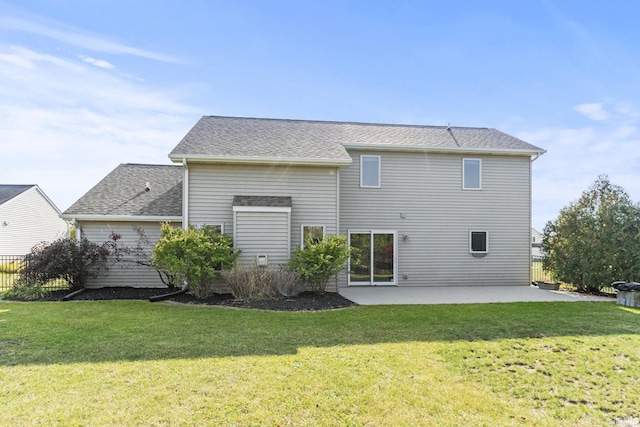 rear view of property with a patio, a lawn, fence, and roof with shingles