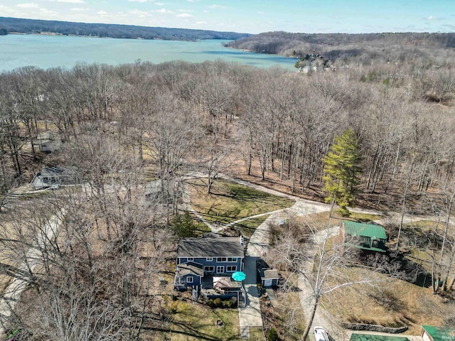 aerial view featuring a water view and a forest view