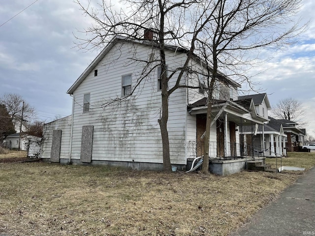 view of home's exterior with covered porch