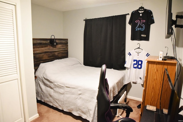 bedroom with carpet and baseboards