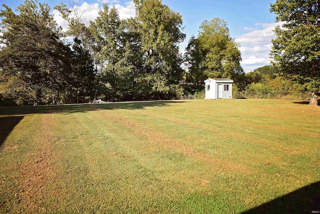 view of yard featuring an outbuilding and a storage shed