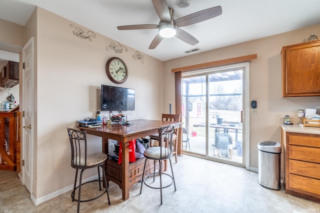 dining area featuring ceiling fan, visible vents, and baseboards