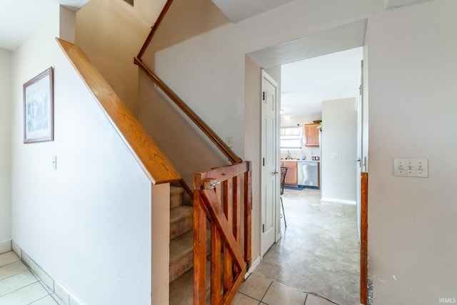 stairs featuring baseboards