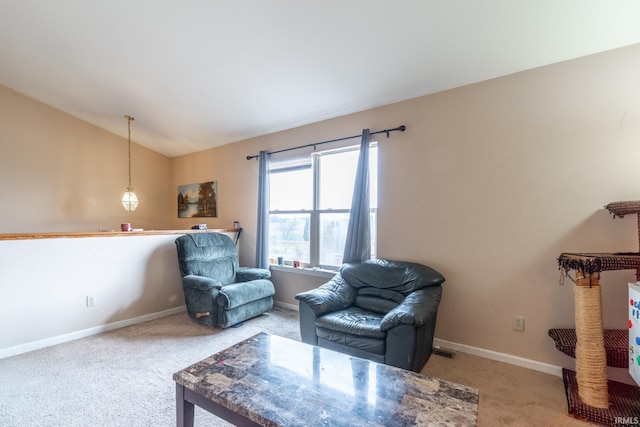 living area featuring carpet, visible vents, baseboards, and vaulted ceiling