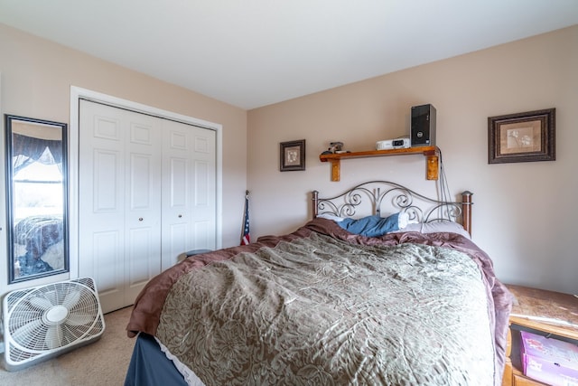 bedroom with a closet and carpet flooring