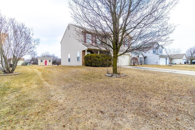 view of front facade with a garage, a front lawn, and concrete driveway