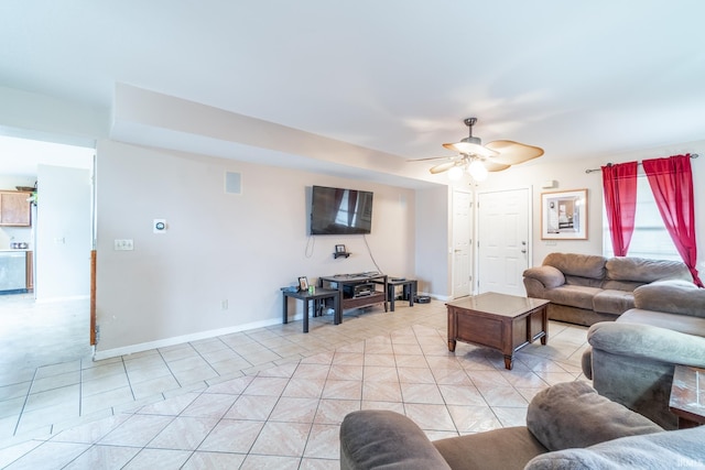 living area featuring visible vents, ceiling fan, baseboards, and light tile patterned floors