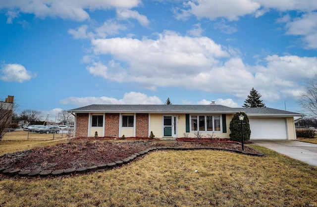 ranch-style house with a garage, brick siding, fence, concrete driveway, and a front lawn