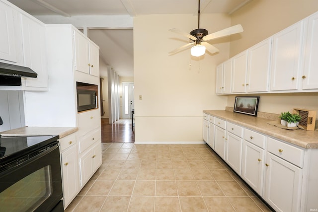 kitchen featuring white cabinets, black appliances, and light tile patterned floors