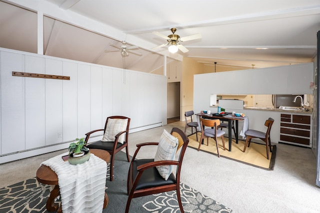 interior space featuring vaulted ceiling with beams, ceiling fan, and carpet