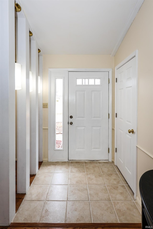 entryway with light tile patterned floors