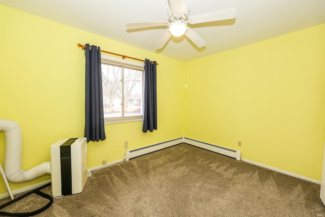 carpeted empty room featuring ceiling fan and baseboards