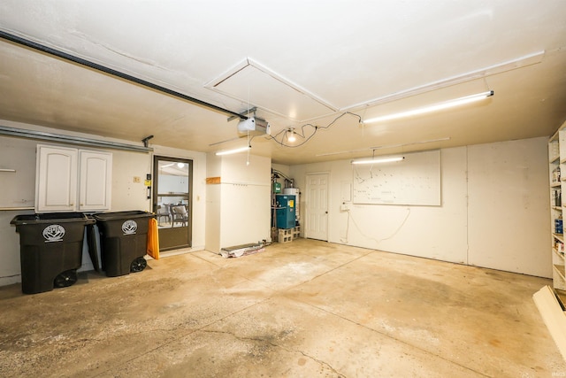 garage with a garage door opener and water heater