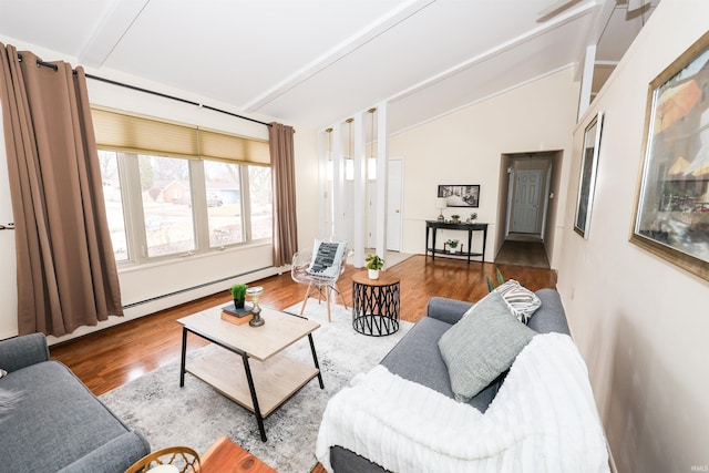 living room with vaulted ceiling with beams and wood finished floors