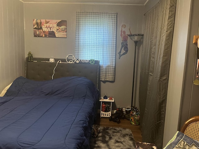 bedroom featuring wood finished floors