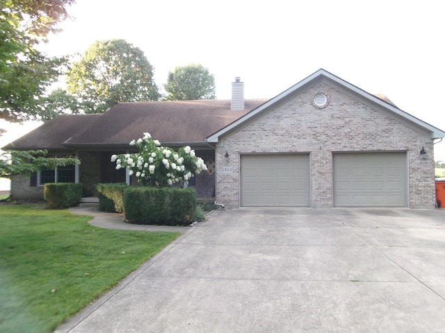 single story home featuring an attached garage, brick siding, concrete driveway, a chimney, and a front yard