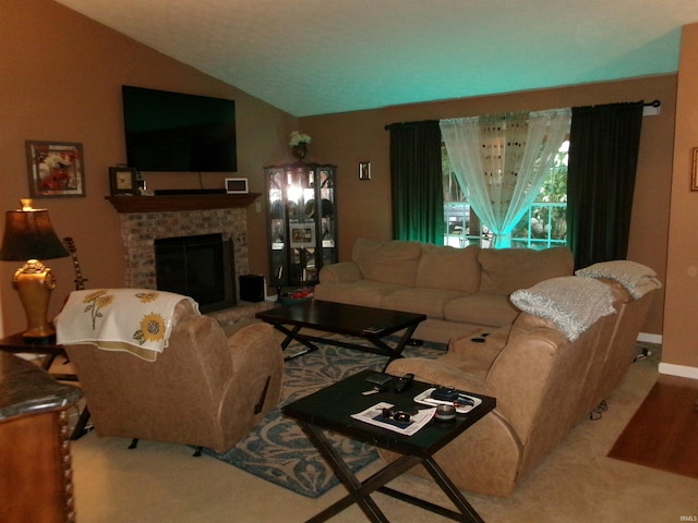 living room with lofted ceiling and a brick fireplace