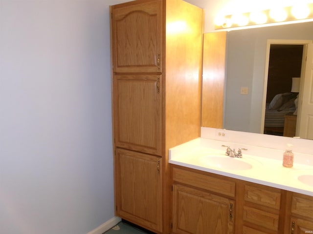 bathroom featuring double vanity and a sink