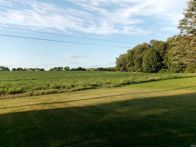 view of yard with a rural view