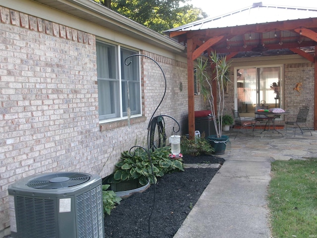 exterior space with a gazebo and cooling unit