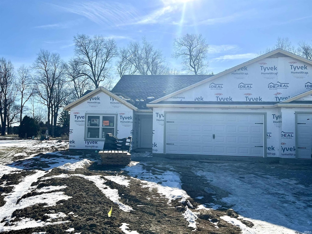 property in mid-construction featuring a garage