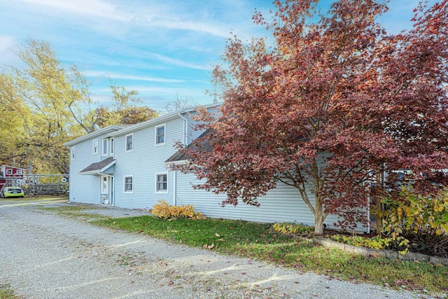 view of side of property with driveway