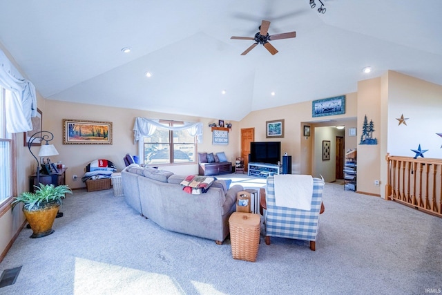 carpeted living room with high vaulted ceiling, visible vents, baseboards, and a ceiling fan