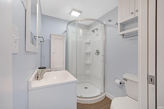 full bathroom with visible vents, a shower stall, toilet, and vanity