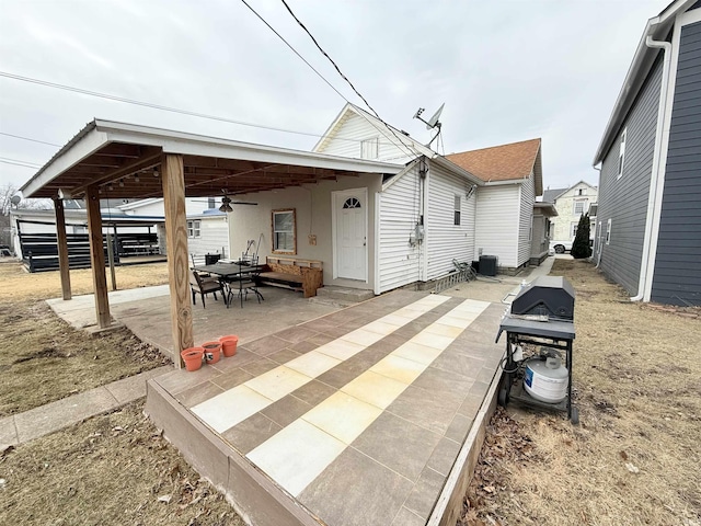 exterior space with a ceiling fan and a patio area