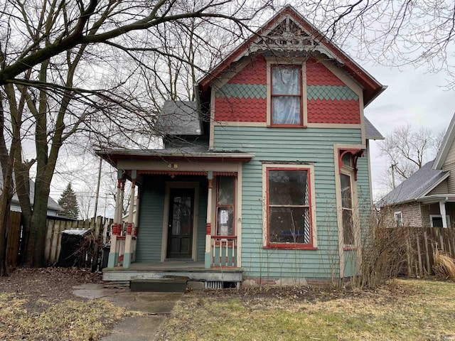 victorian house with fence and a porch