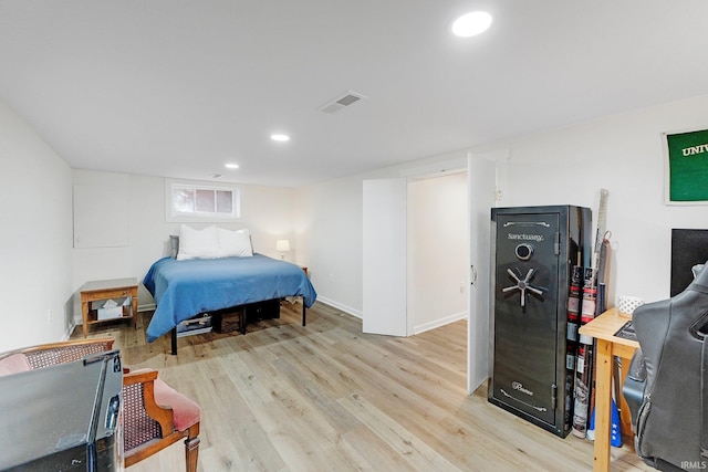 bedroom with recessed lighting, visible vents, light wood-style flooring, and baseboards