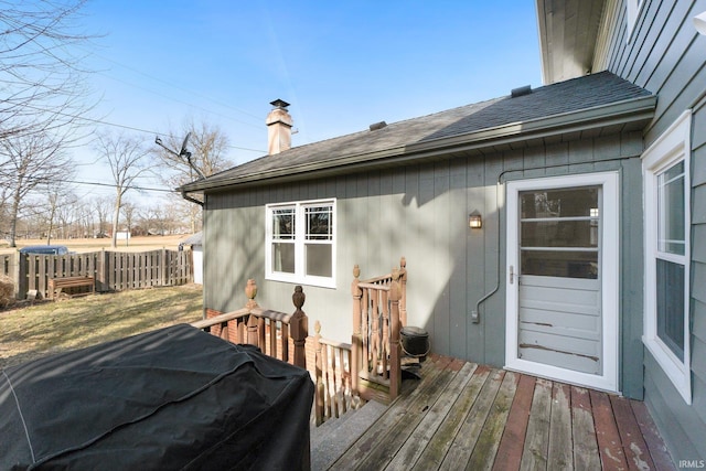 wooden deck featuring fence and area for grilling