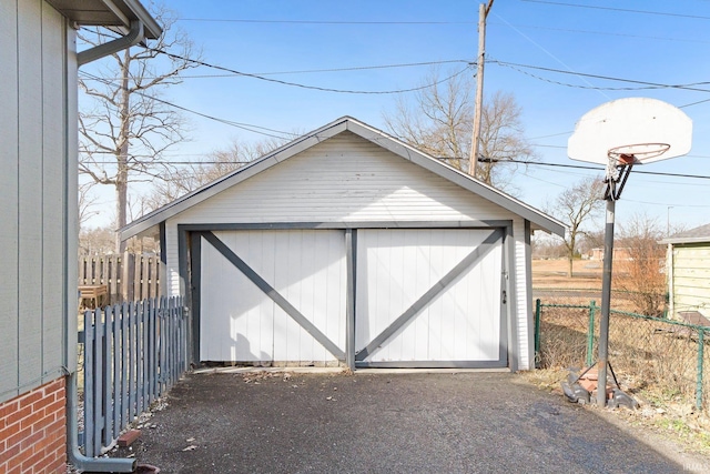 garage with fence