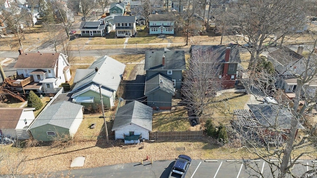 birds eye view of property with a residential view