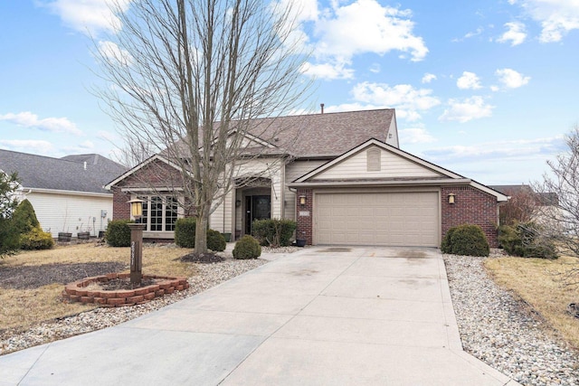 view of front of property featuring a garage, brick siding, and driveway