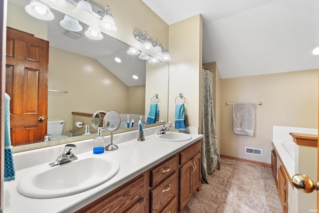 full bathroom featuring lofted ceiling, a sink, and visible vents