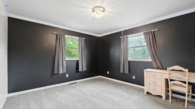 interior space with baseboards, carpet floors, visible vents, and crown molding