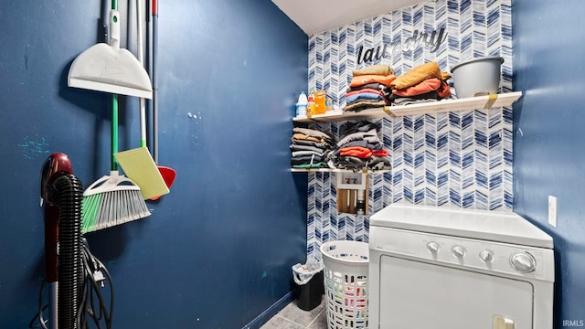 interior space with laundry area, washer / clothes dryer, and tile patterned flooring