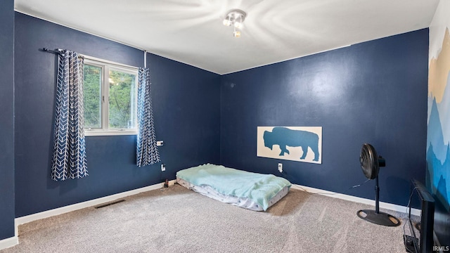 bedroom with carpet flooring, visible vents, and baseboards