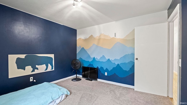 bedroom featuring carpet and baseboards